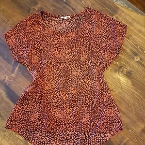 Silky coral and black print blouse